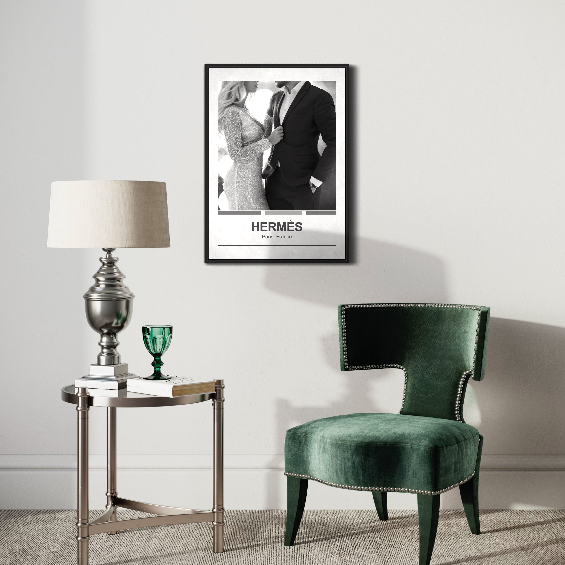 Modern living room with green velvet chair, side table, lamp, and framed Hermès poster on wall
