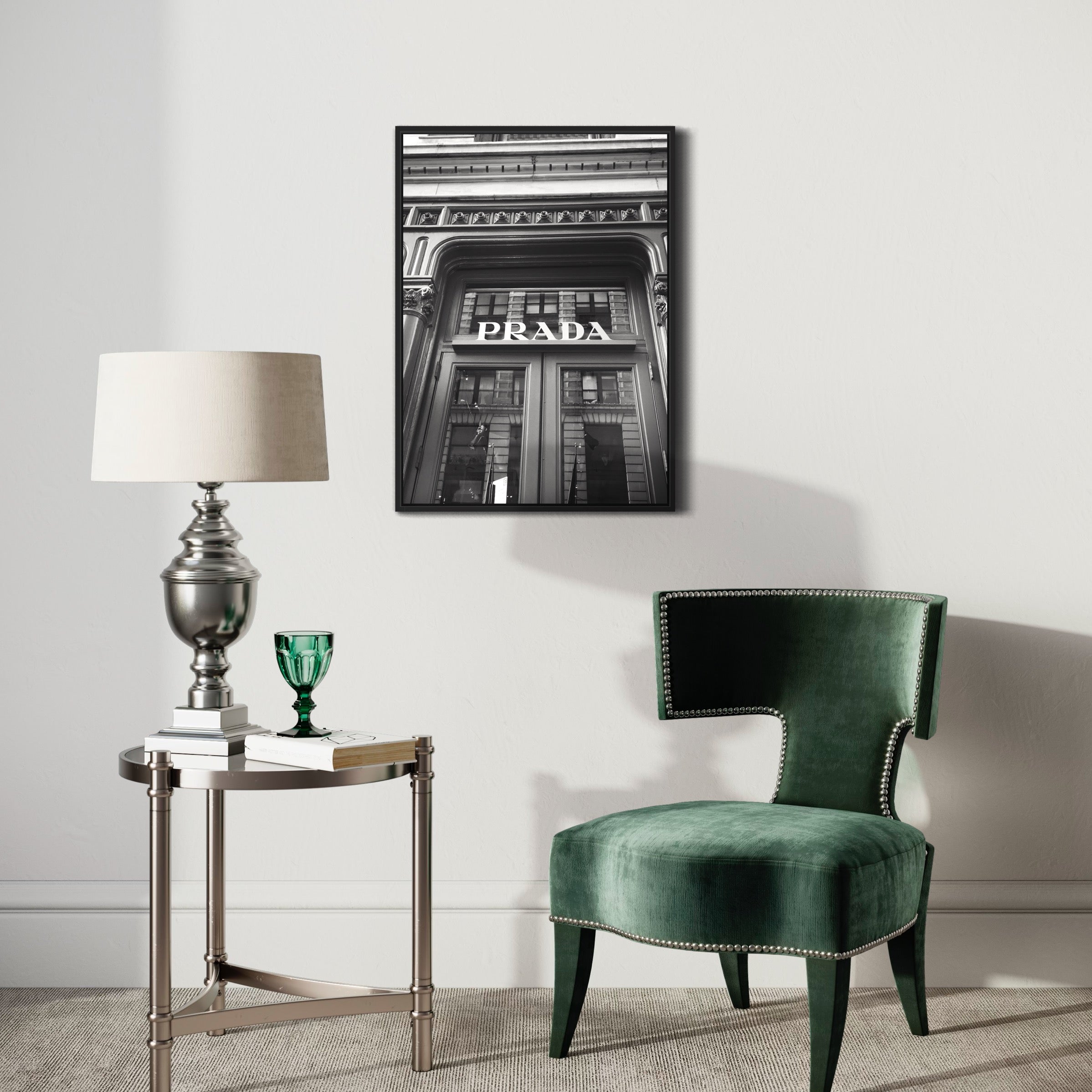 Black and white Prada poster in stylish living room with velvet chair and side table.