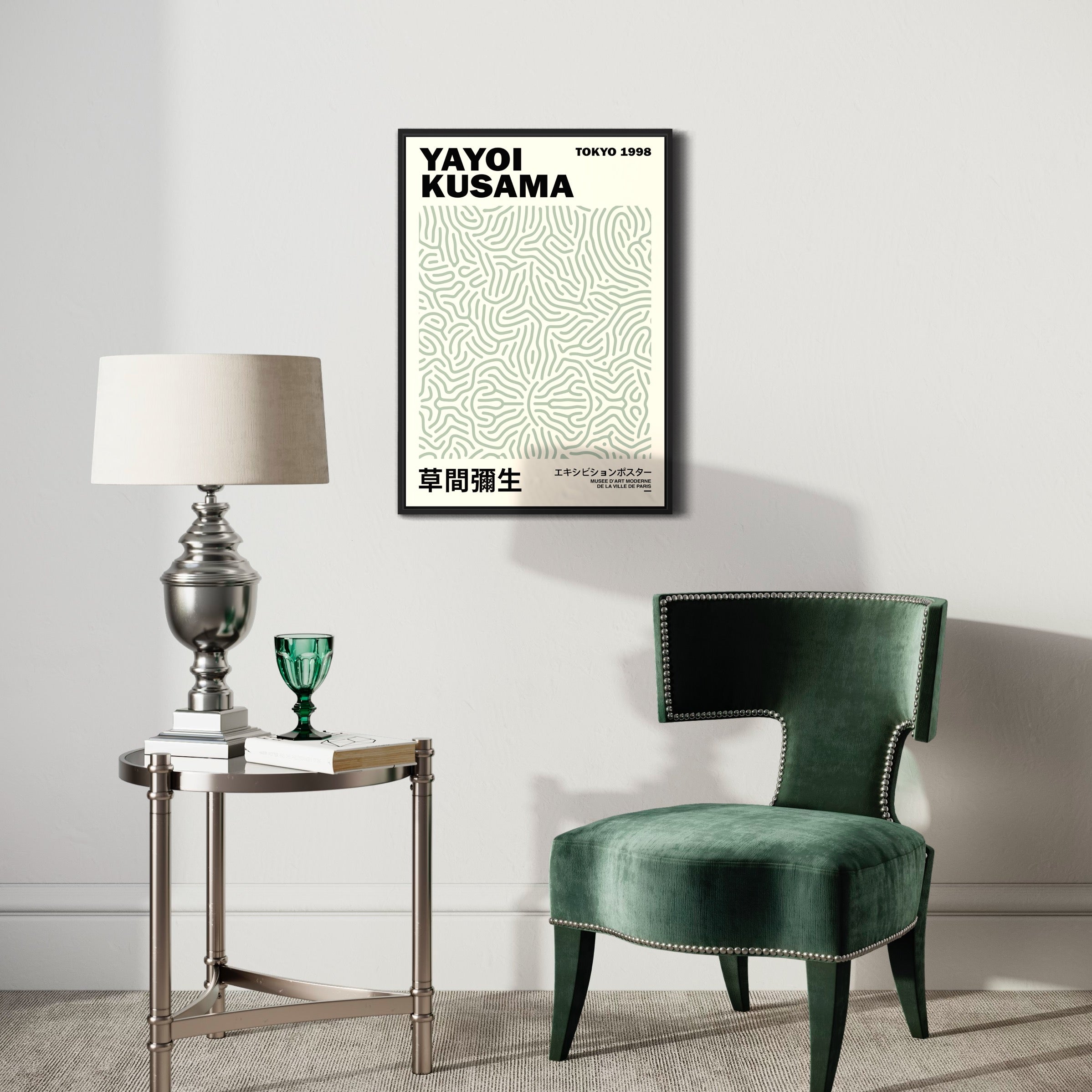 Modern living room with abstract art poster, green velvet chair, lamp and side table decor.