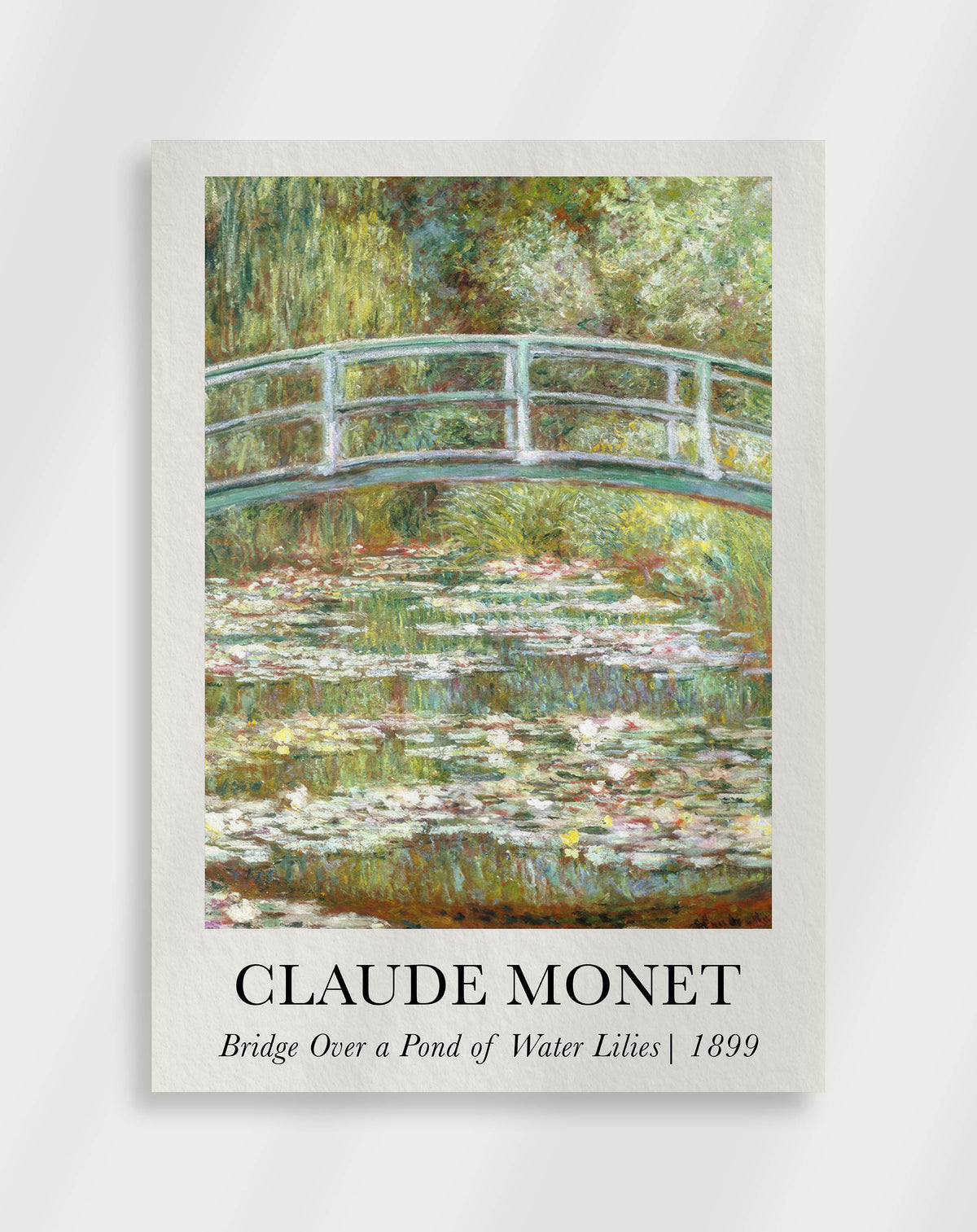 Garden bridge over water with soft reflections and greenery by Claude Monet