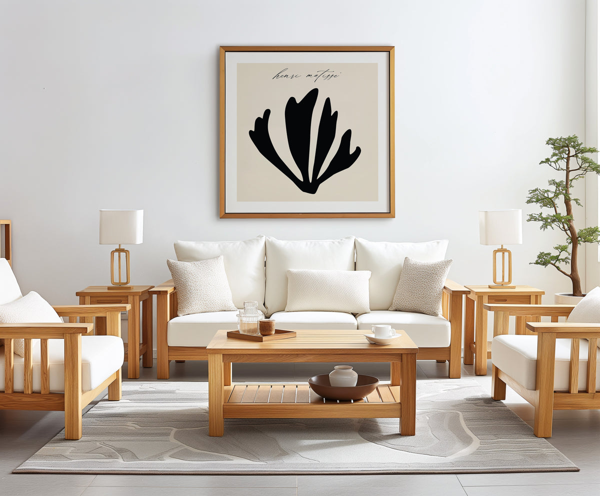 Henri Matisse black cut-out poster in a gold frame, hanging above a sofa