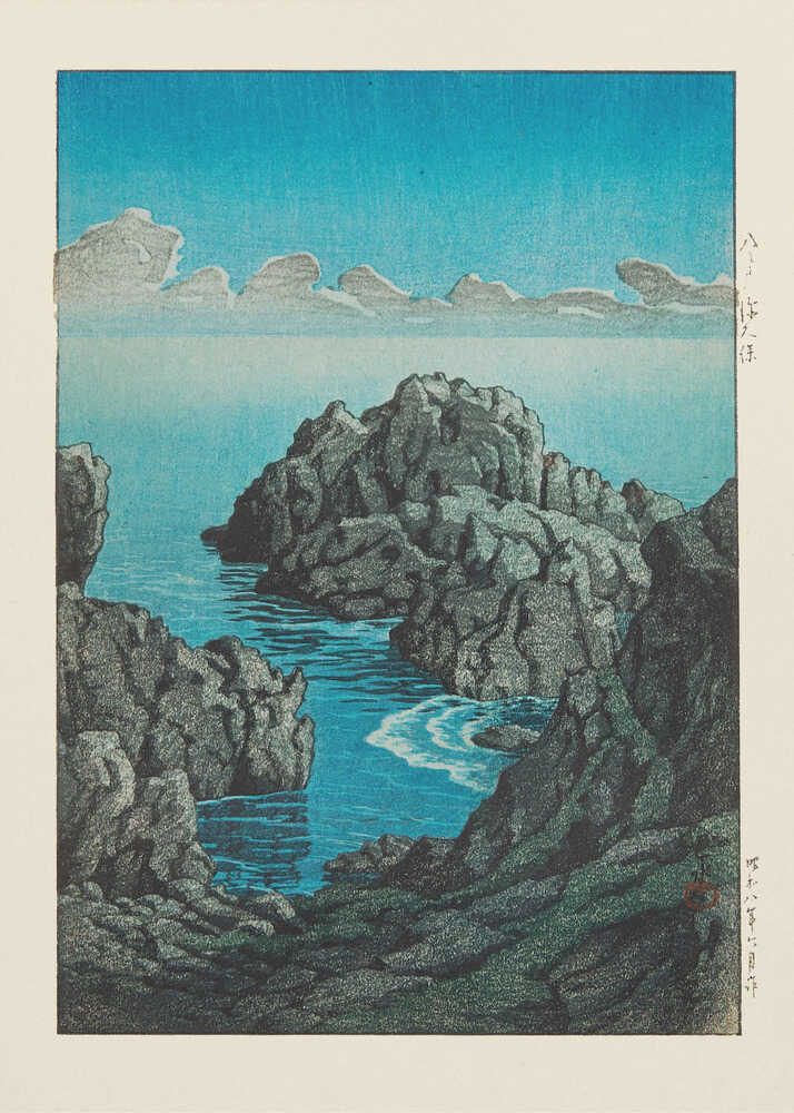 Japandi rocky coast poster with dark rocks and a blue sea under clouds