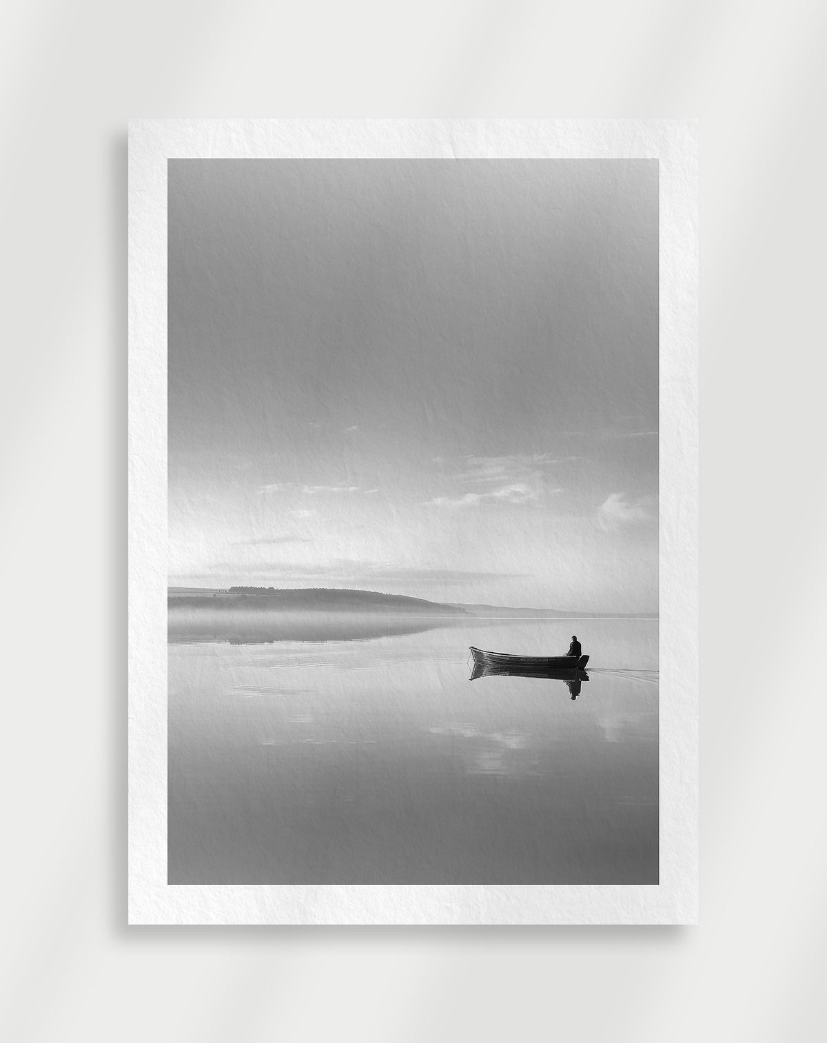 Misty lake boat poster with a black and white view of a small boat on a calm misty lake