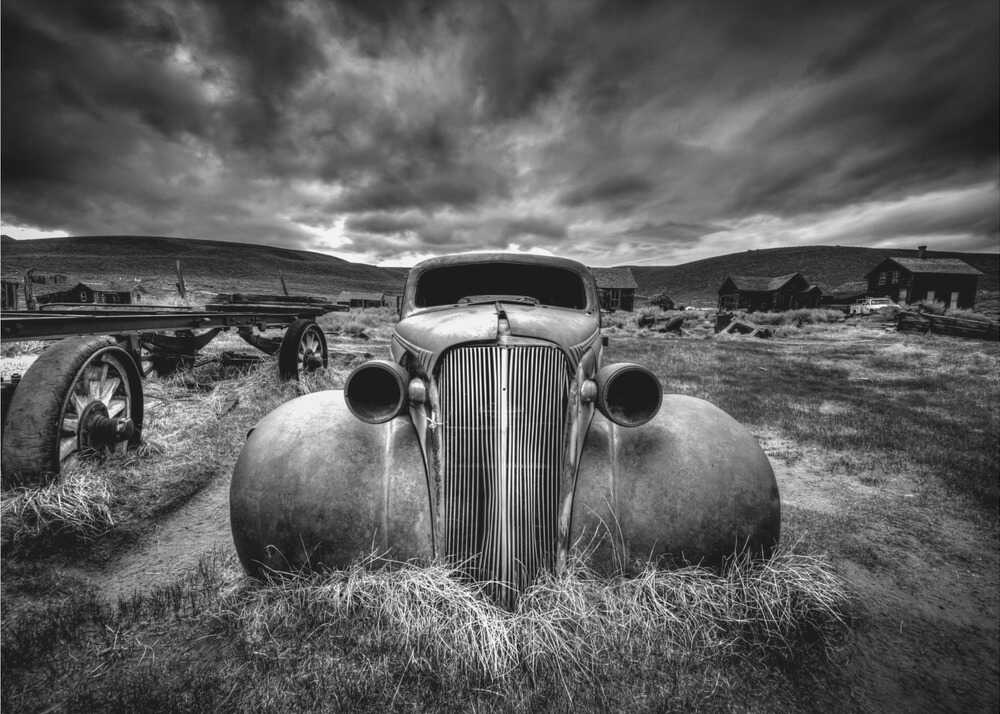 Rusted vintage car poster with a black and white view of a rusted classic car in a field